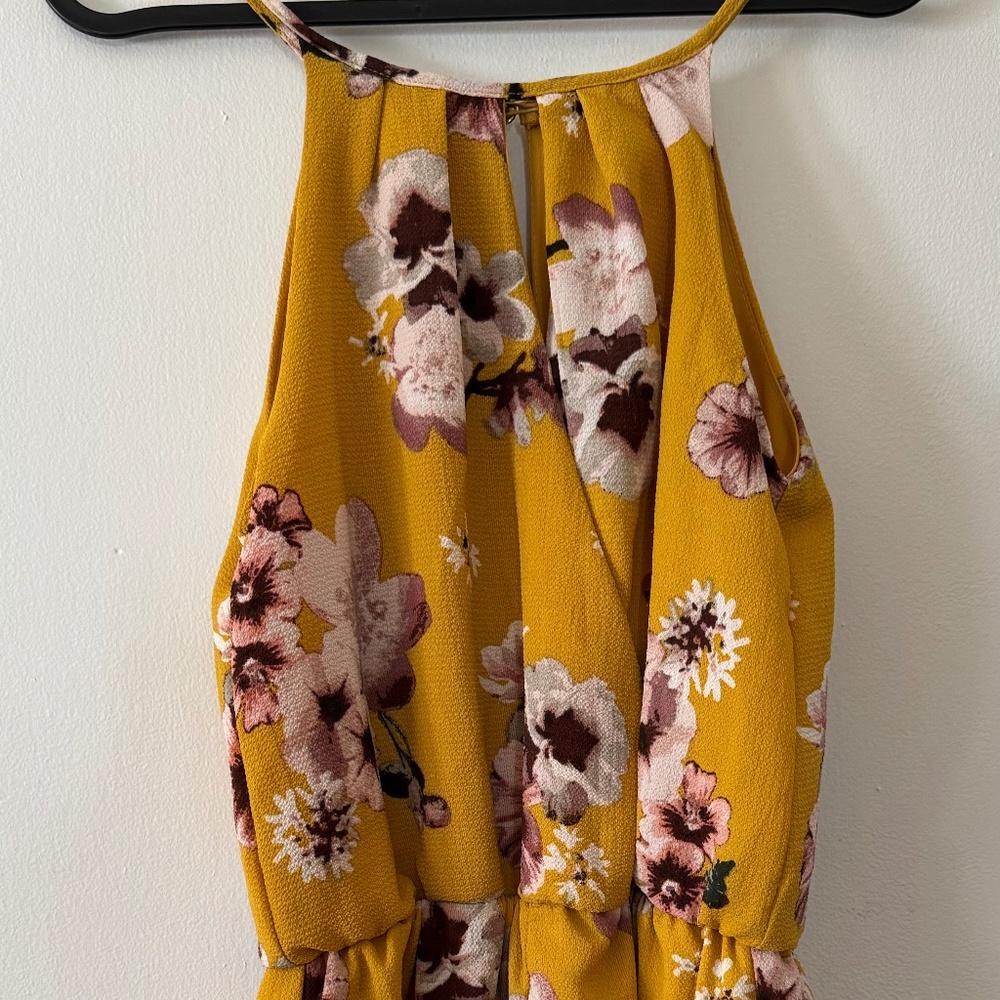 Mustard romper with floral pattern